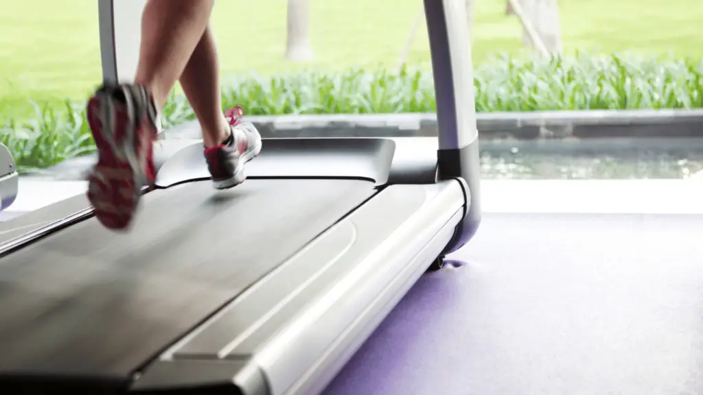 Close up of someone running on a treadmill