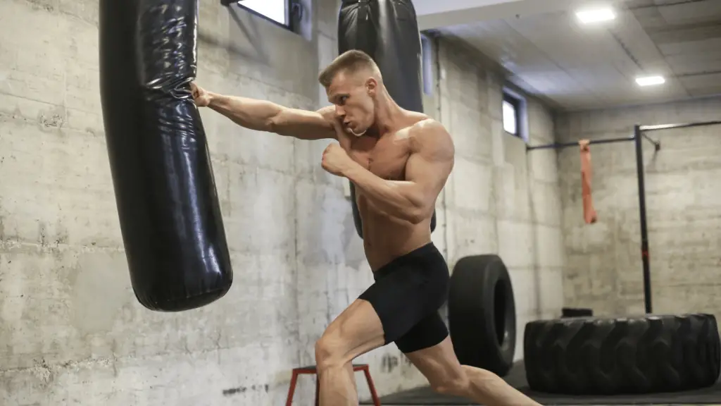 Man exercising using punching bag 