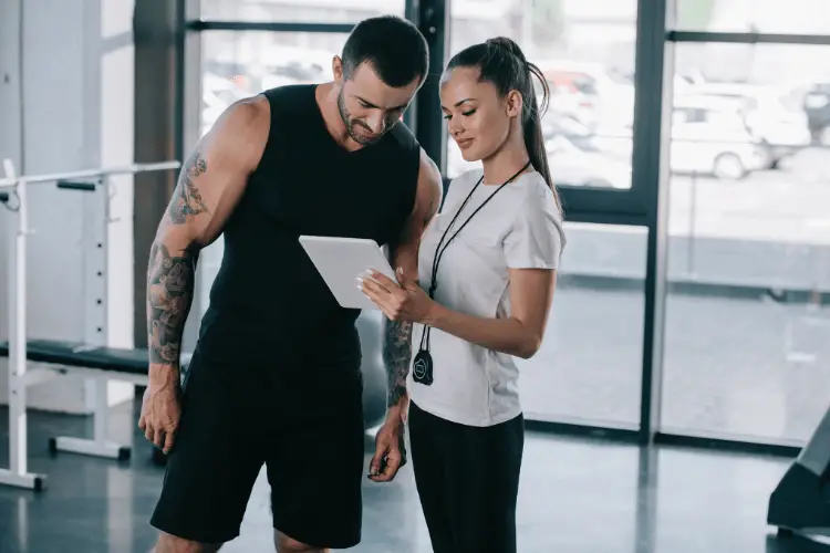 female personal trainer with her athlete