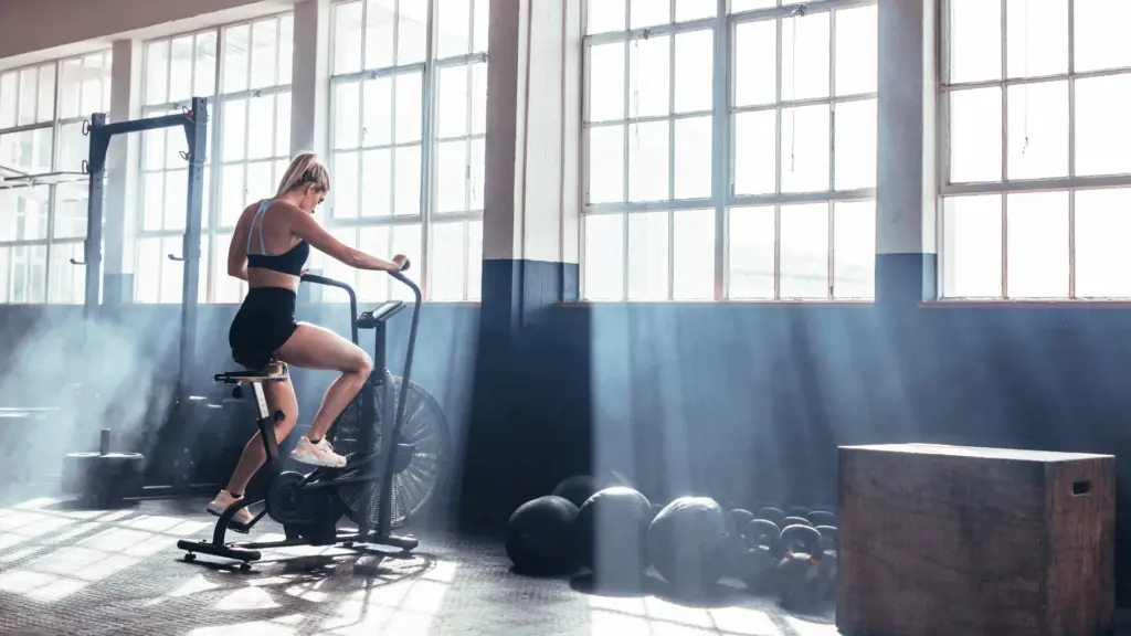 Woman exercising on an air bike