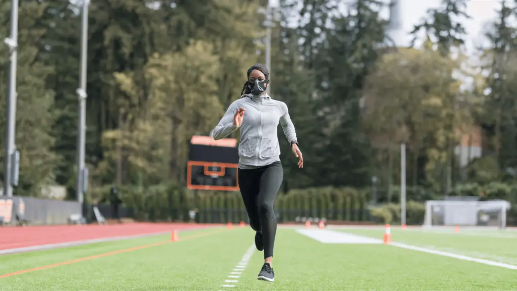 Woman wearing an endurance mask while running