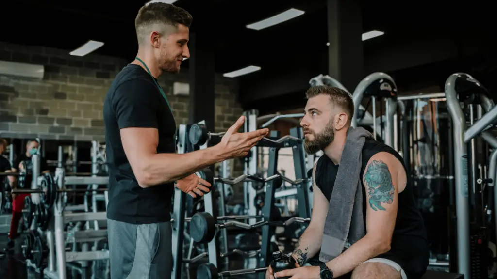 Personal trainer talking to an athlete