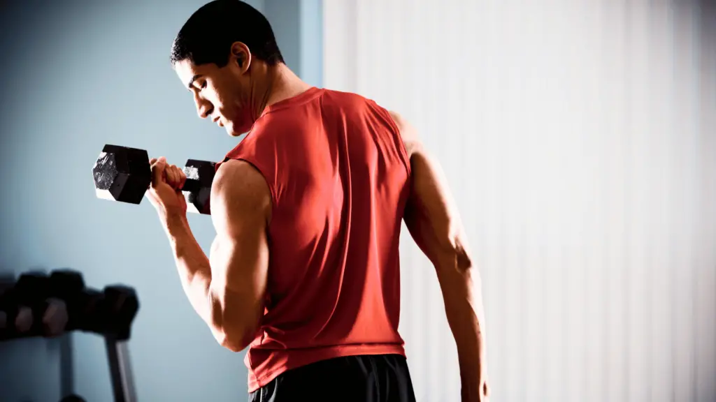 Man holding dumbbell during exercise