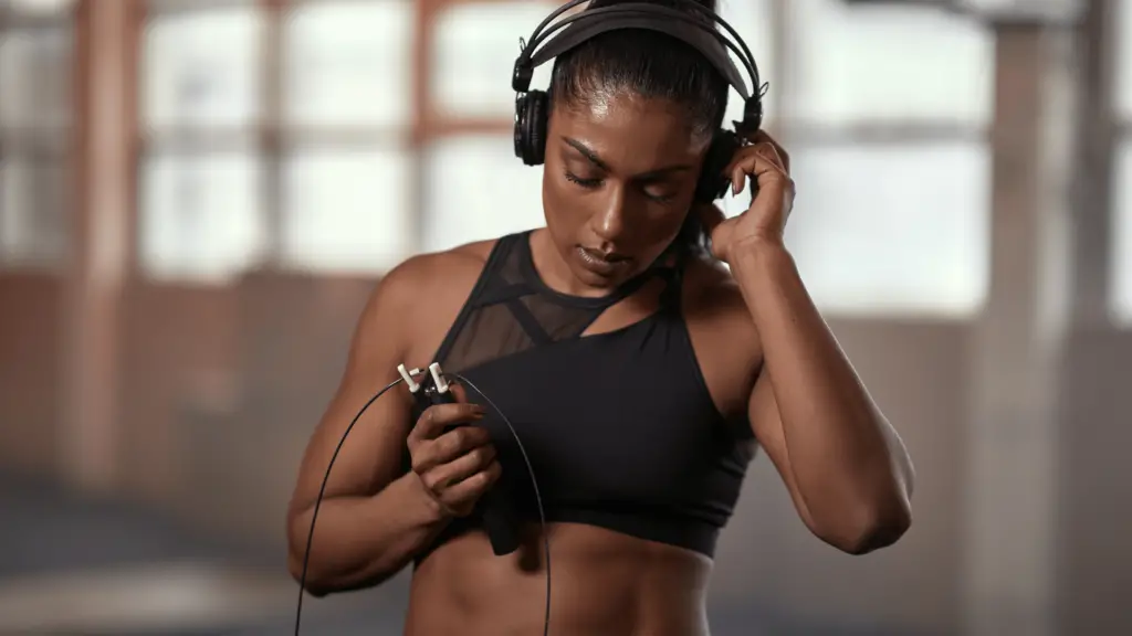 Woman listening to music in the gym