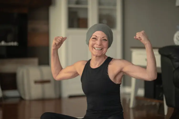 Recovering cancer patient flexing 