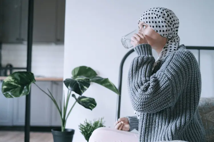 Cancer patient taking a pill