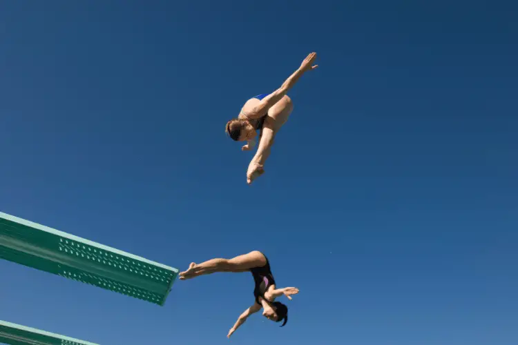 Kids diving off board