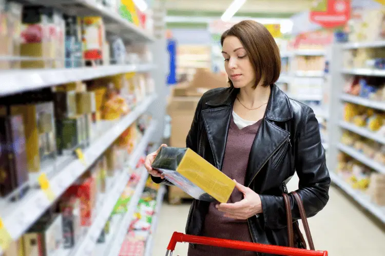 Woman reading nutrition label