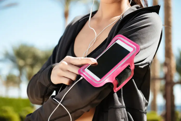 Woman with her phone in an armband while working out