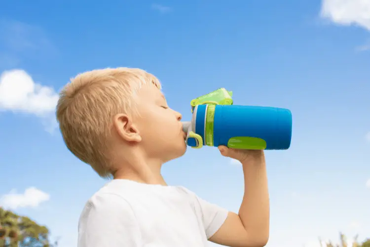 A boy drinking water 