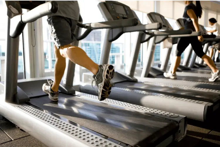 a man running on treadmill close up