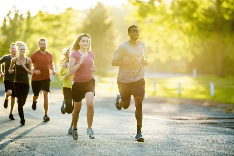 a group of people running outdoor 