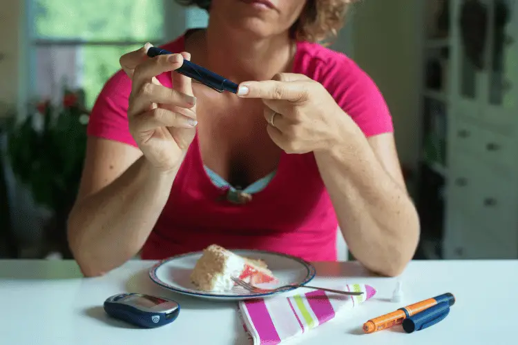 a diabetic woman measuring her blood sugar before eating 