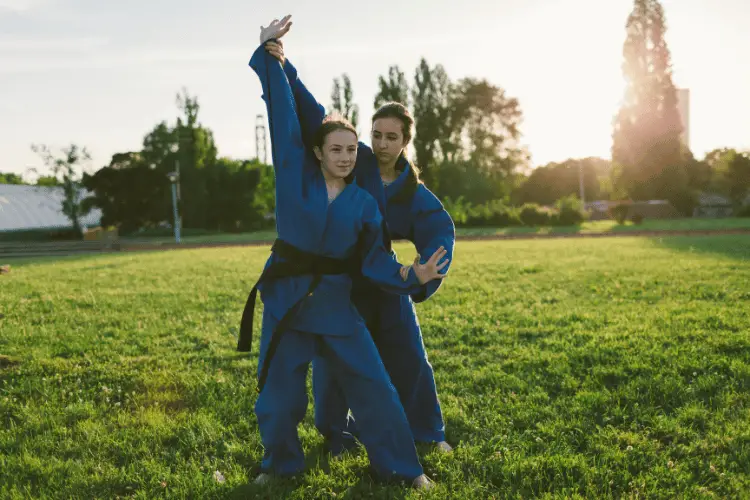 2 girls doing Aikido outdoor