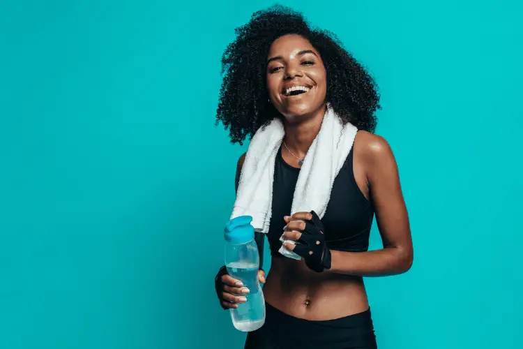A lady smiling after working out 