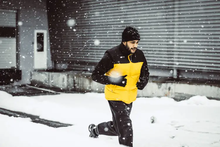 A young man exercising in winter